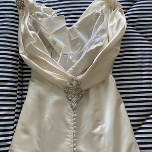 Wedding dress never worn or altered.